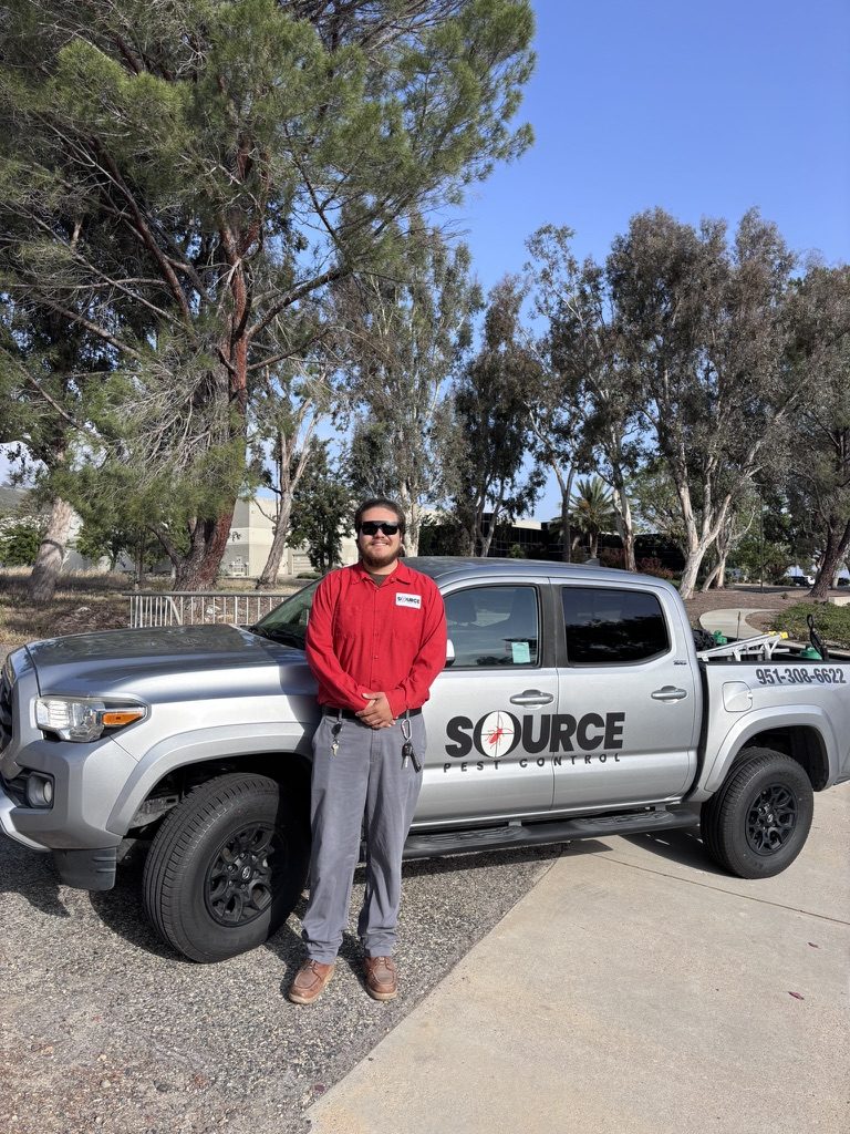 Source Pest Control technician and service truck